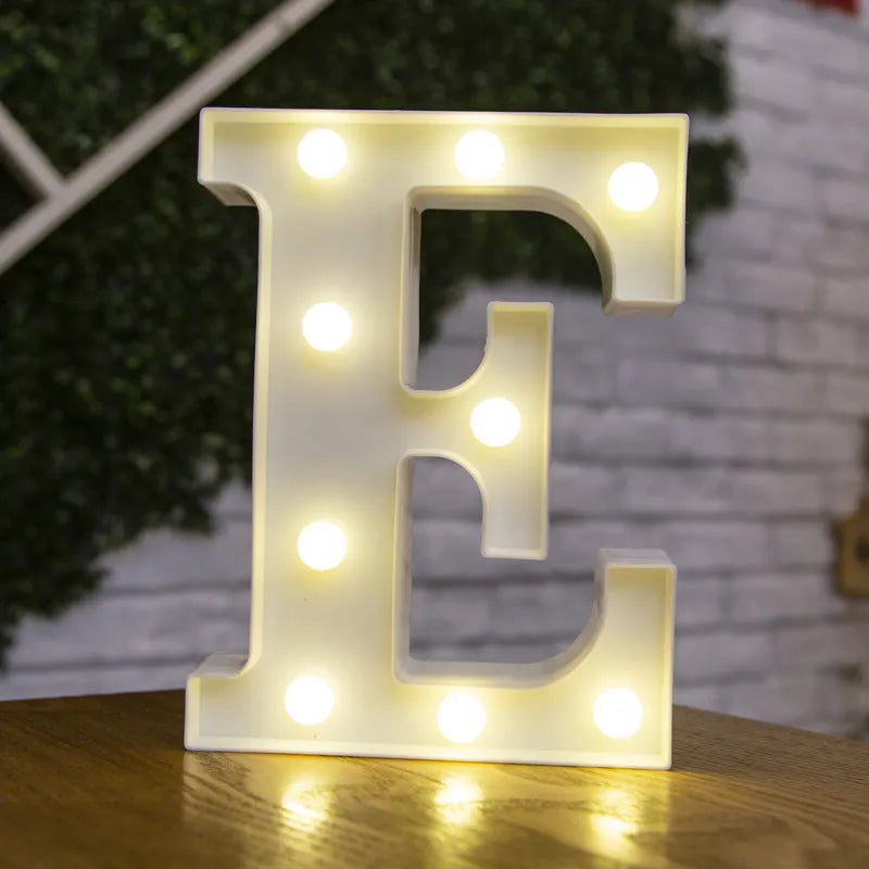 White plastic LED marquee letter sign with warm white glow, 22cm tall