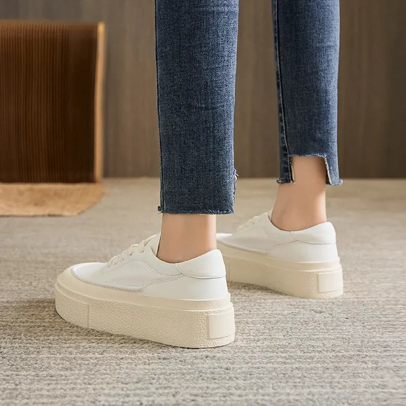 Women's black and white platform sports board shoes with embossed cowhide uppers and round toe design