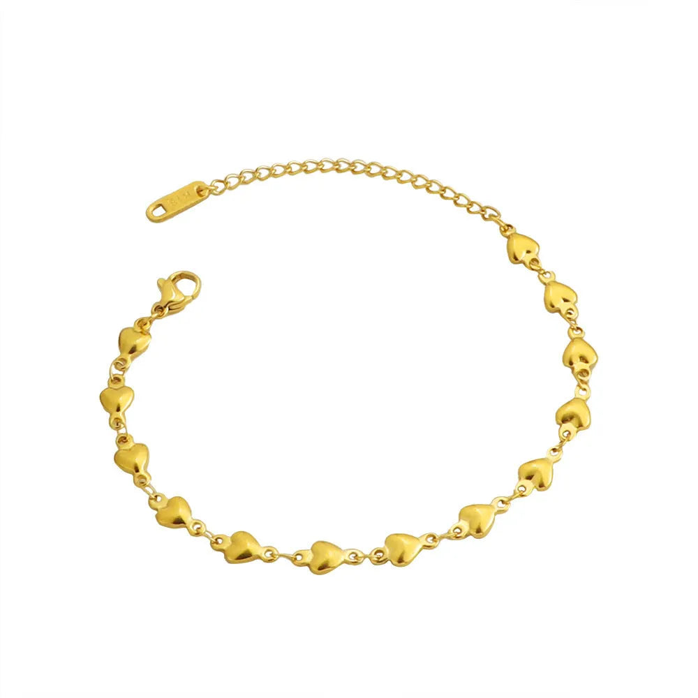 Titanium steel gold chain heart bracelet electroplated colour for women on white background