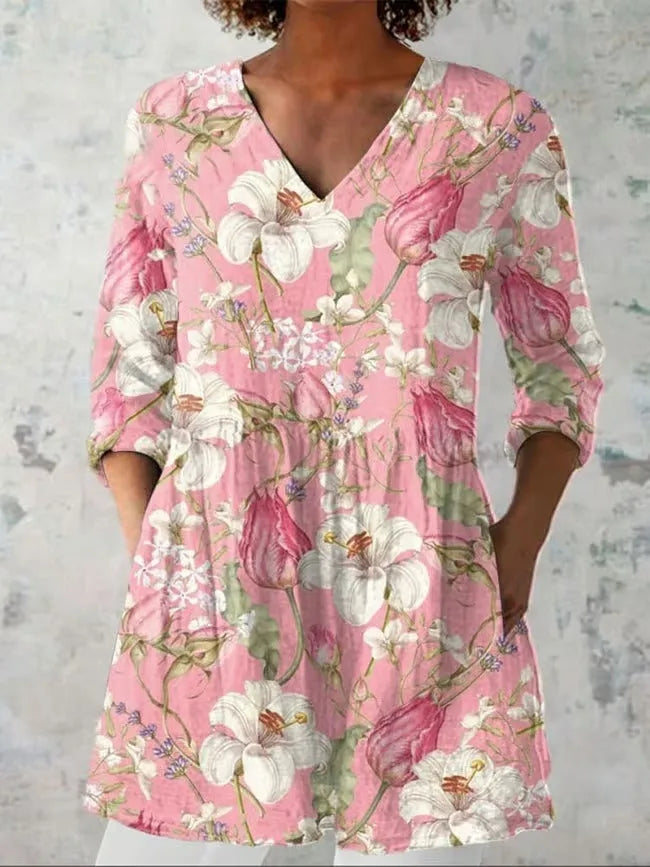 Women's retro patterned long-sleeved top with V-neck on a hanger