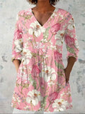 Women's retro patterned long-sleeved top with V-neck on a hanger