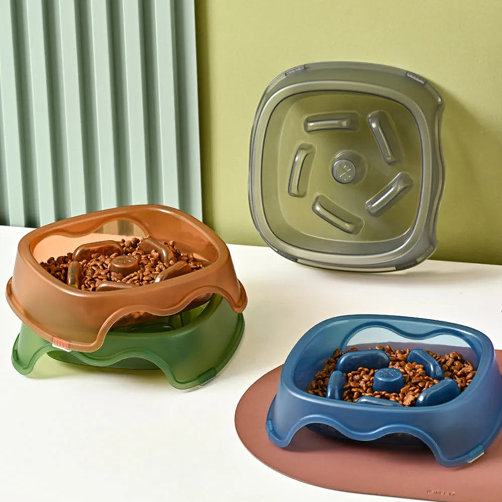 Blue plastic slow feeder dog bowl with internal ridges to prevent choking.