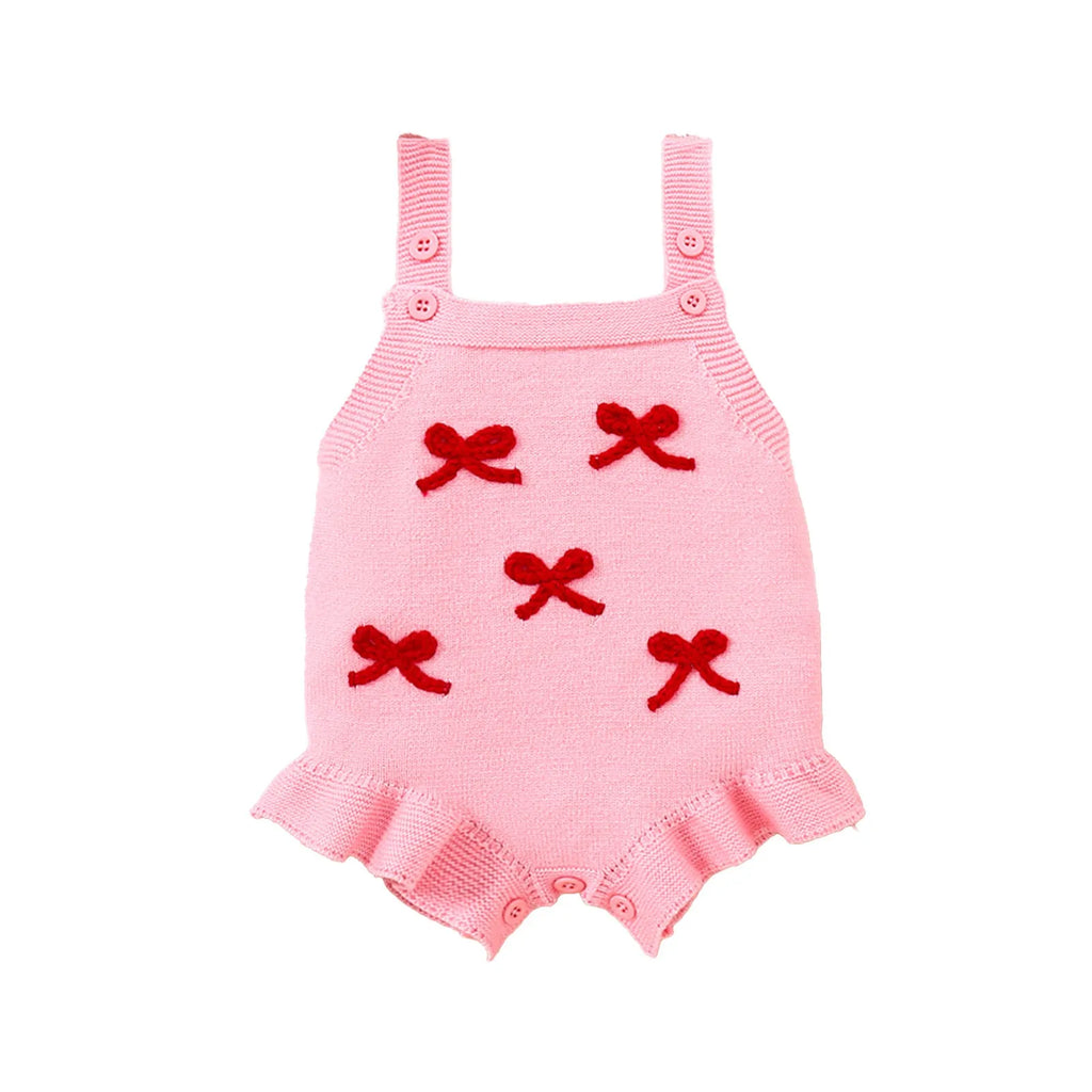 Baby girl sling romper in white with bow embroidery on wool blend fabric.