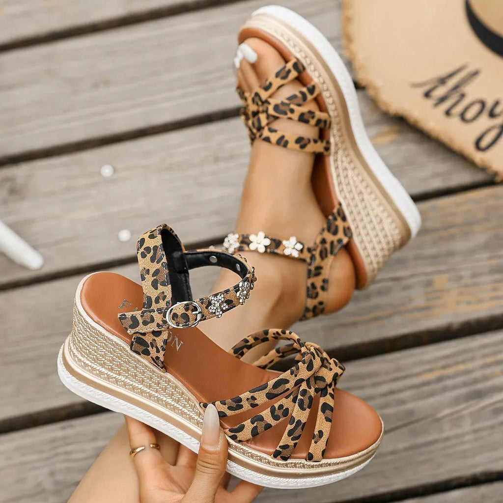 Light brown suede women's platform sandals with ankle buckle and open toe on a white background.