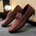 Men's black slip-on loafers with round toe and low stiletto heel, showing sewing thread detailing on artificial PU leather upper