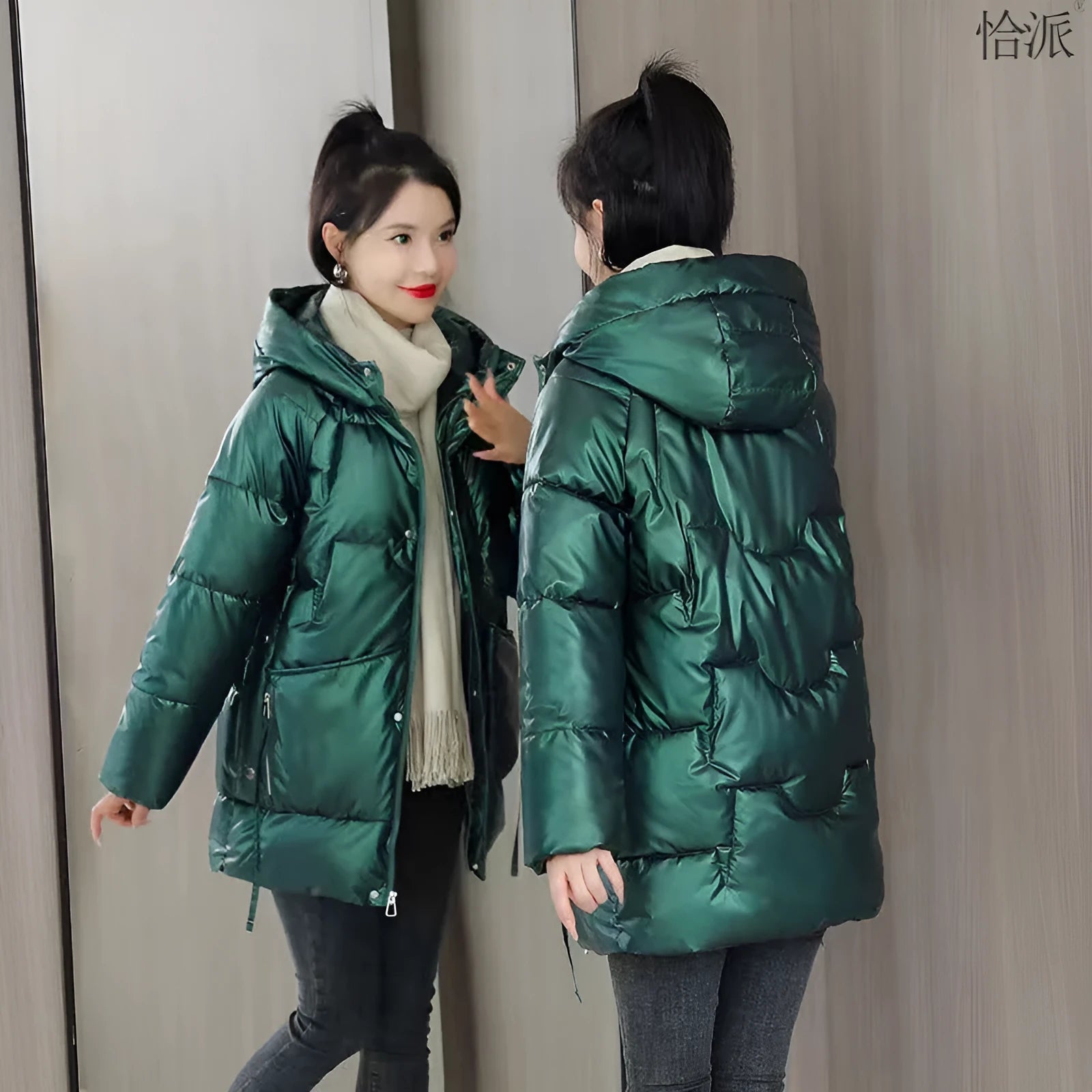 A woman wearing a loose-fit forest green hooded winter jacket, showcasing its relaxed silhouette and long sleeves.