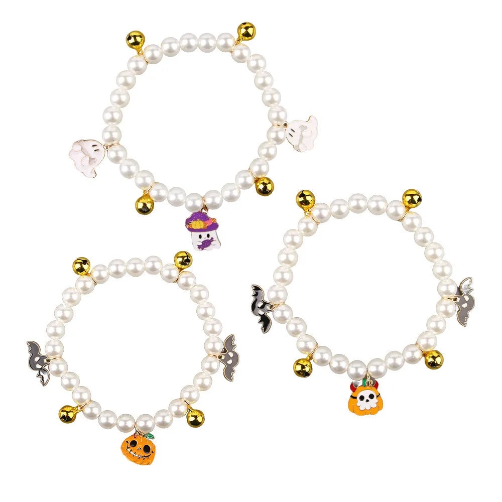 Decorative Halloween cat collar with simulated pearls and pumpkin charm in purple ghost design