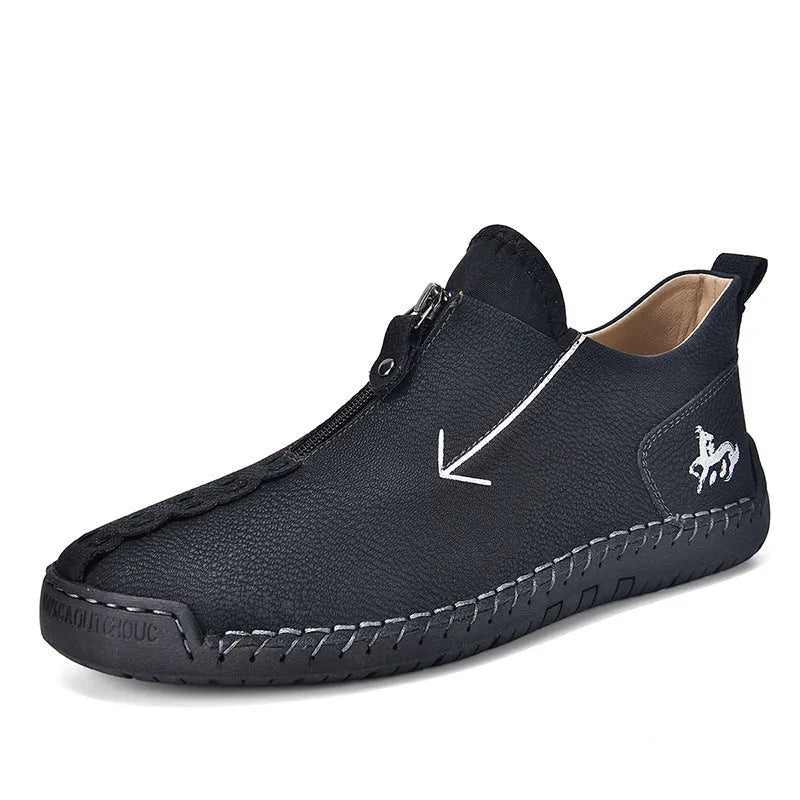 Men's black casual leather boots with a front side zipper and a hand-stitched rubber sole.