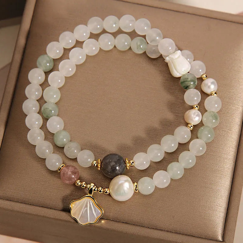 Women's crystal bracelet with artistic ginkgo leaf pendant and rhinestone accents