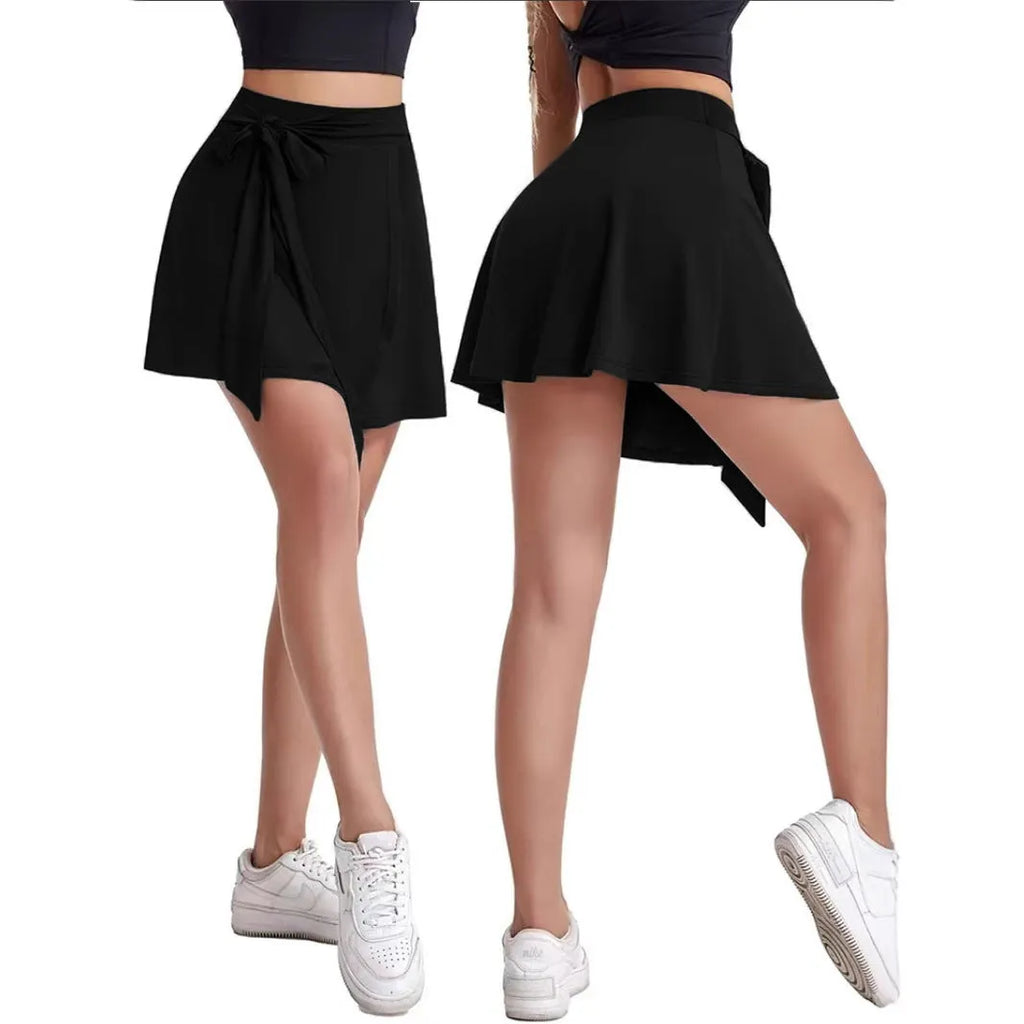 Black thigh-length sports culottes skirt with built-in shorts, high waist, and shoulder strap details