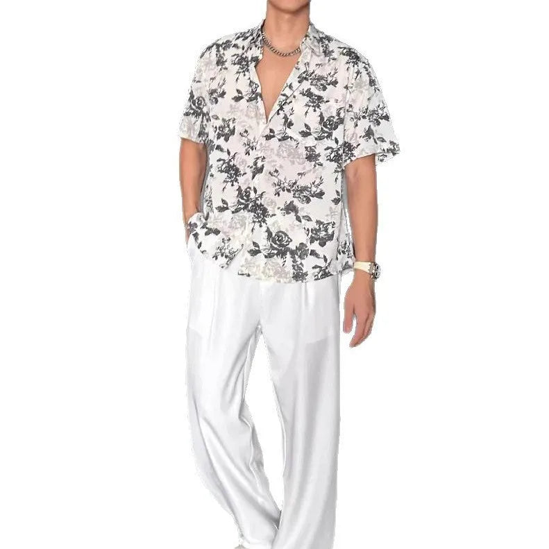 Loose-fitting white women's short sleeve shirt with a floral print pattern.