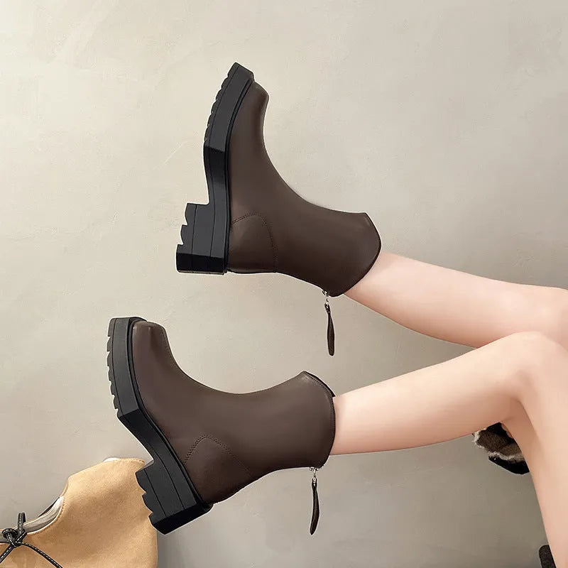 Black platform Martin boots for women with a square toe and back zipper.