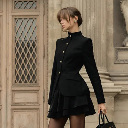 Women's black solid colour stand collar suit set with blazer and short dress on display