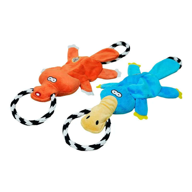 Two cotton string molar sound dog toys in suit colour on a surface