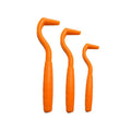 Set of three coloured plastic tick removal hooks for dogs on a white background.
