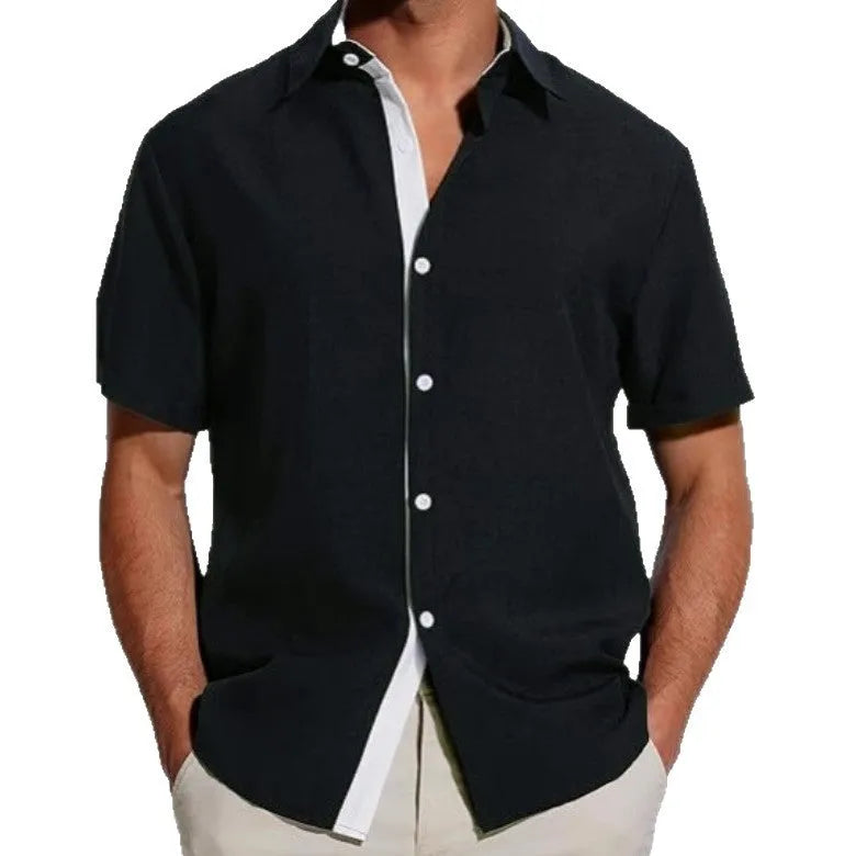 Men's floral print short-sleeved shirt in light grey polyester fabric on a hanger.