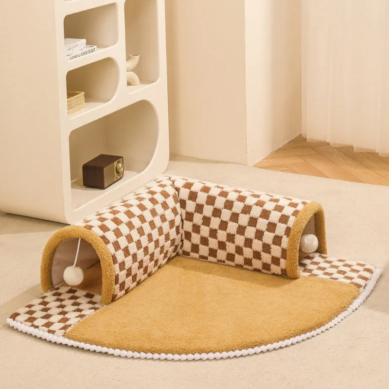 Brown plaid cat tunnel bed with central mat, showing non-slip bottom and fluffy plush material.