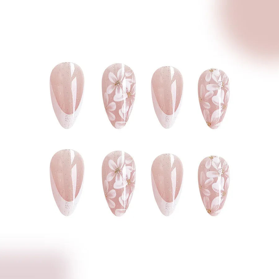 Short almond French manicure artificial nails with glitter and flower patterns in colour C625.