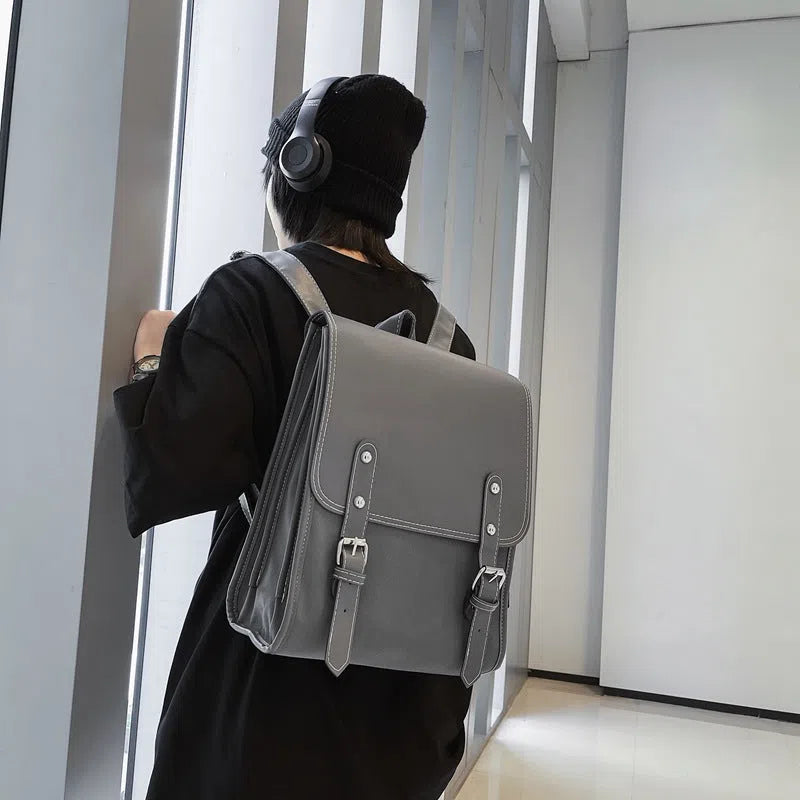 Motorcycle-style PU leather backpack with geometric pattern, buckle, laptop and camera compartments, 20-35L capacity, in black