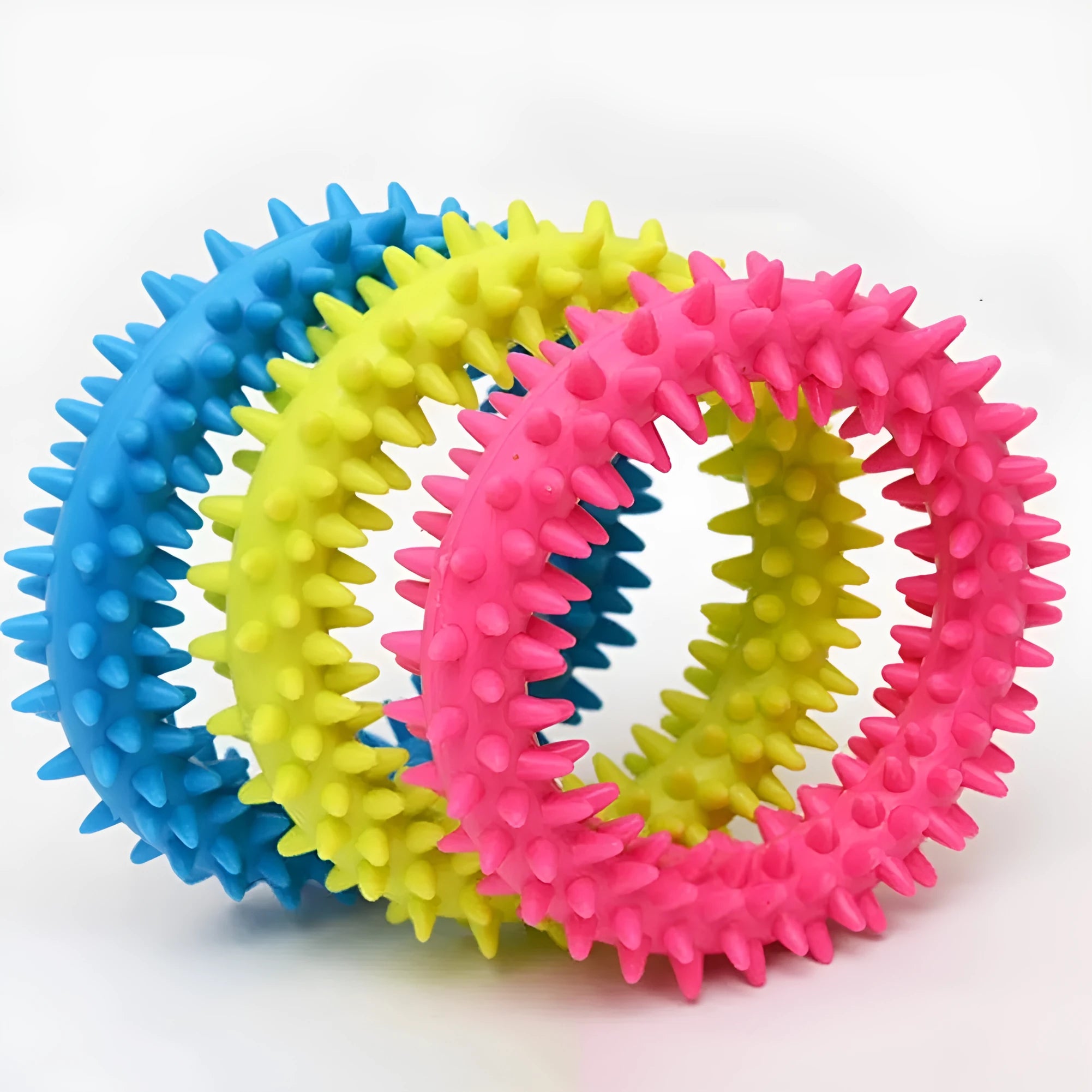 Blue TPR spiky ring dog chew toy for dental cleaning and bite training on a white background.