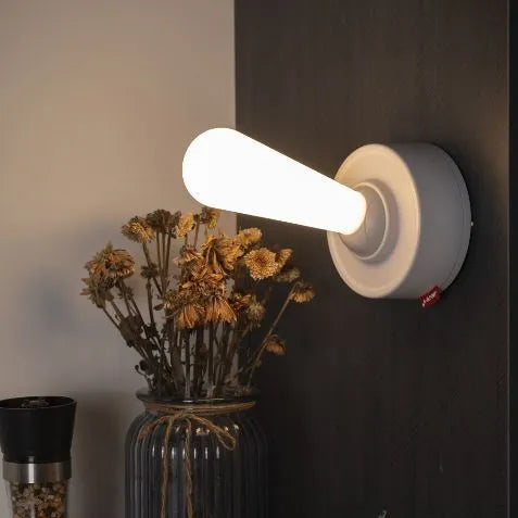 Toggle silicone USB rechargeable night light with warm LED, wall mounted in bedroom
