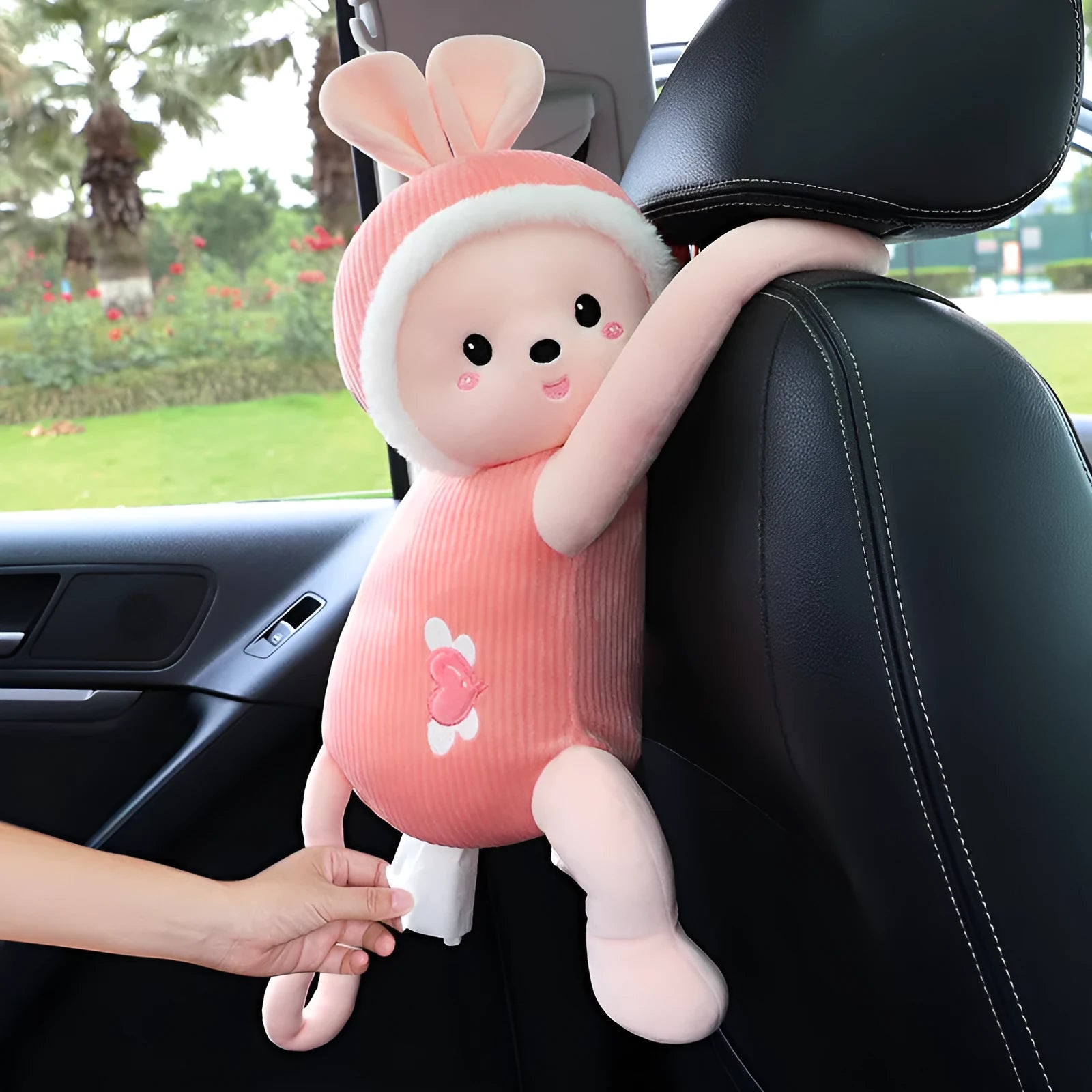 Plush car seat back tissue box holder with cute animal design mounted on car headrest
