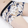 Men's ice silk plus size boxer shorts on a mannequin, showing mid waist design and blue colour.