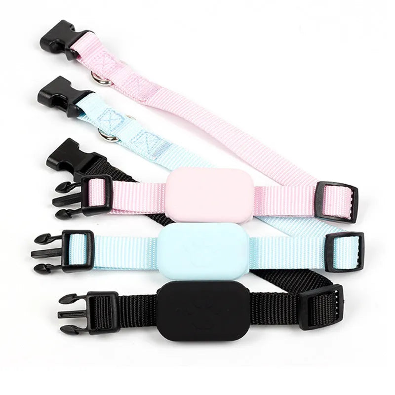 Black Bluetooth pet positioning collar with adjustable strap on a grey background.