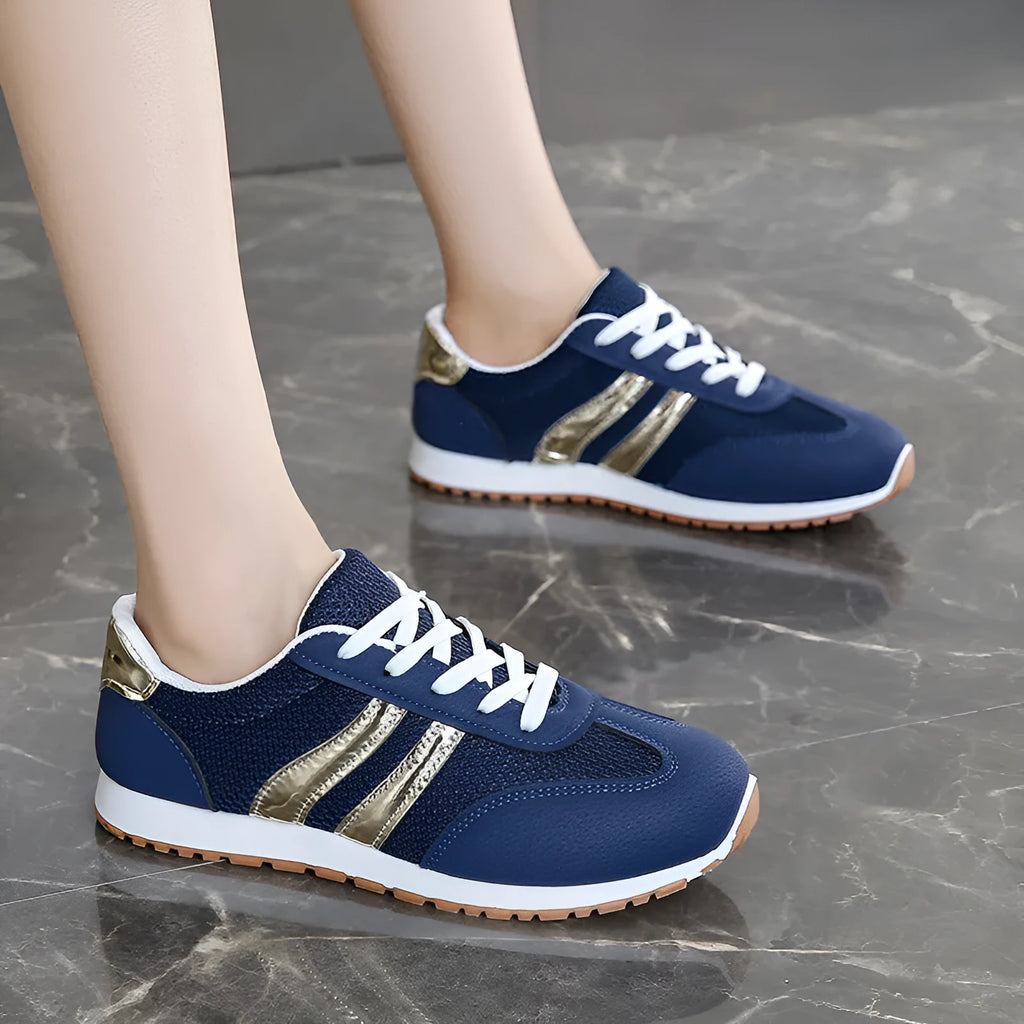 Blue women's casual sports shoes with cross shoulder straps and a white rubber sole.