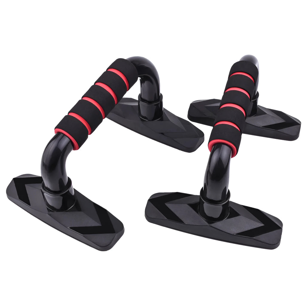 A pair of I-shaped black push up bars with textured PP sponge grip handles on a grey floor.