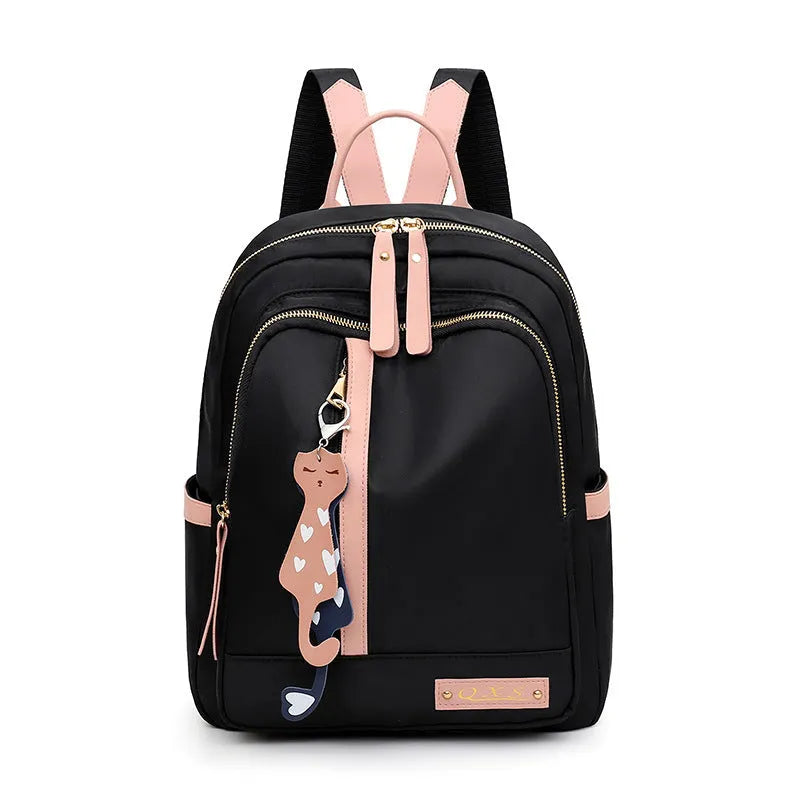 Soft black nylon women's casual backpack with double straps, external pocket, and internal organisers.