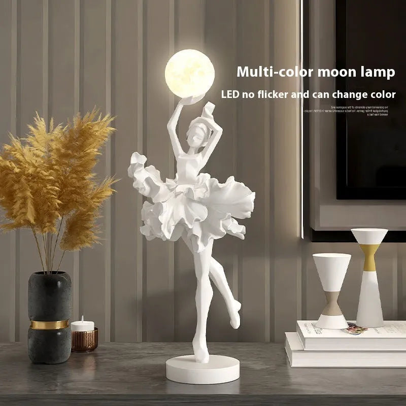 Small modern resin night lamp in black gold colour with USB charging cable.