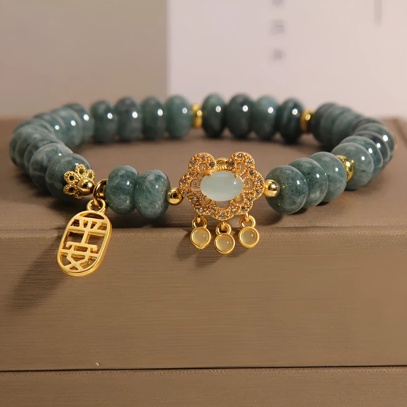Women's natural emerald jade bracelet with abacus beads and safety lock closure