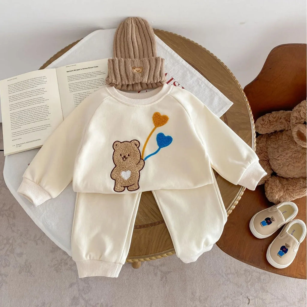 Baby suit in light beige with cute bear ball pattern, long-sleeved sweater and matching trousers, cotton fabric