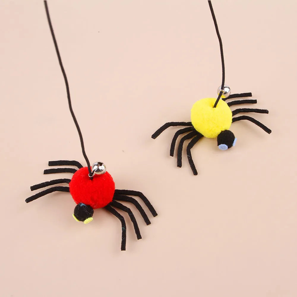 Red and yellow hanging cat toy with elastic rope, feather ball, bell and spider attachment for door mounting