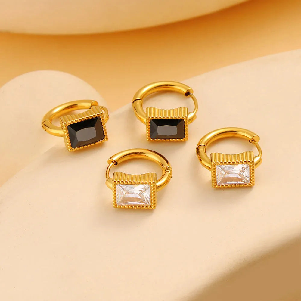 Geometric stainless steel earrings with a square zircon, available in white, black and green.