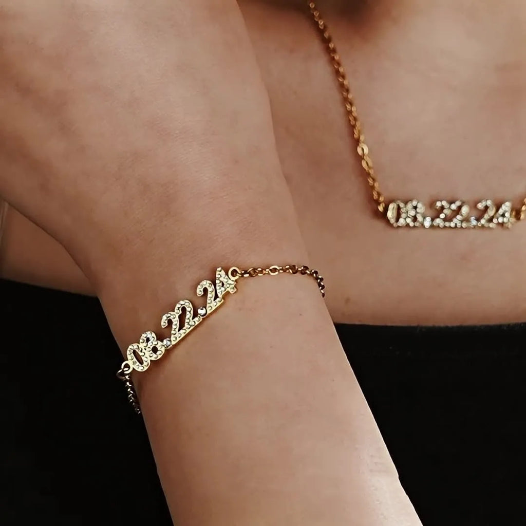 Stainless steel digital bracelet with diamond-studded numbers in gold finish