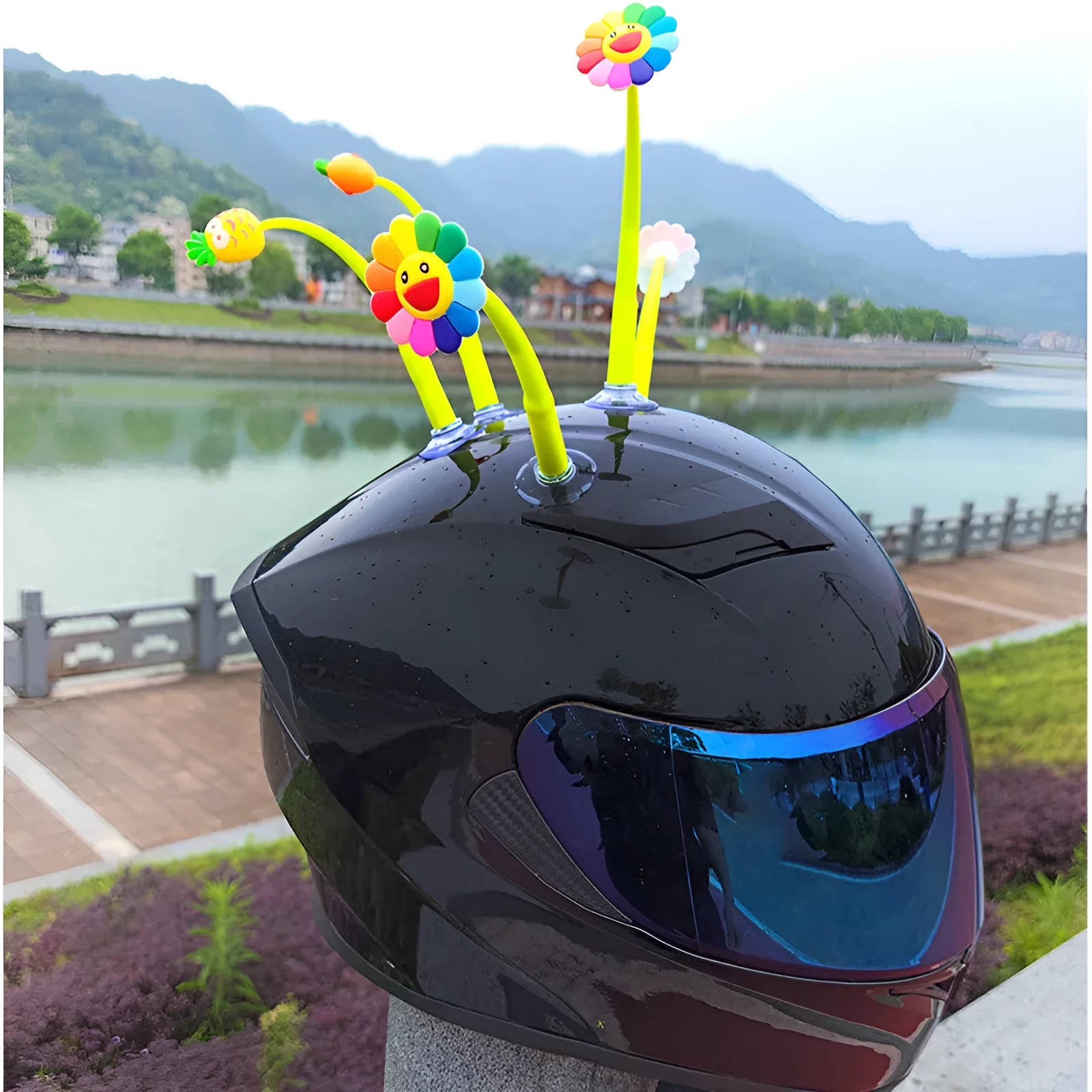 Yellow silicone sunflower decoration with a clear suction cup for helmet attachment.