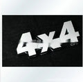 Metal 3D 4x4 rear car badge sticker in silver plated finish on a vehicle boot