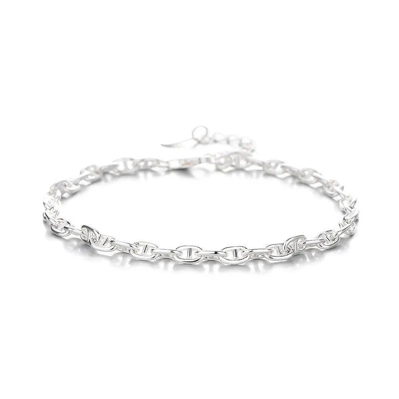 Minority stackable bracelet in polished 925 sterling silver pig nose chain style on white background