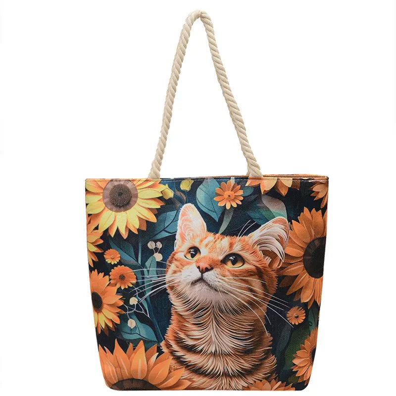 A soft cotton and linen string shoulder handbag with two straps and an open outer pocket.