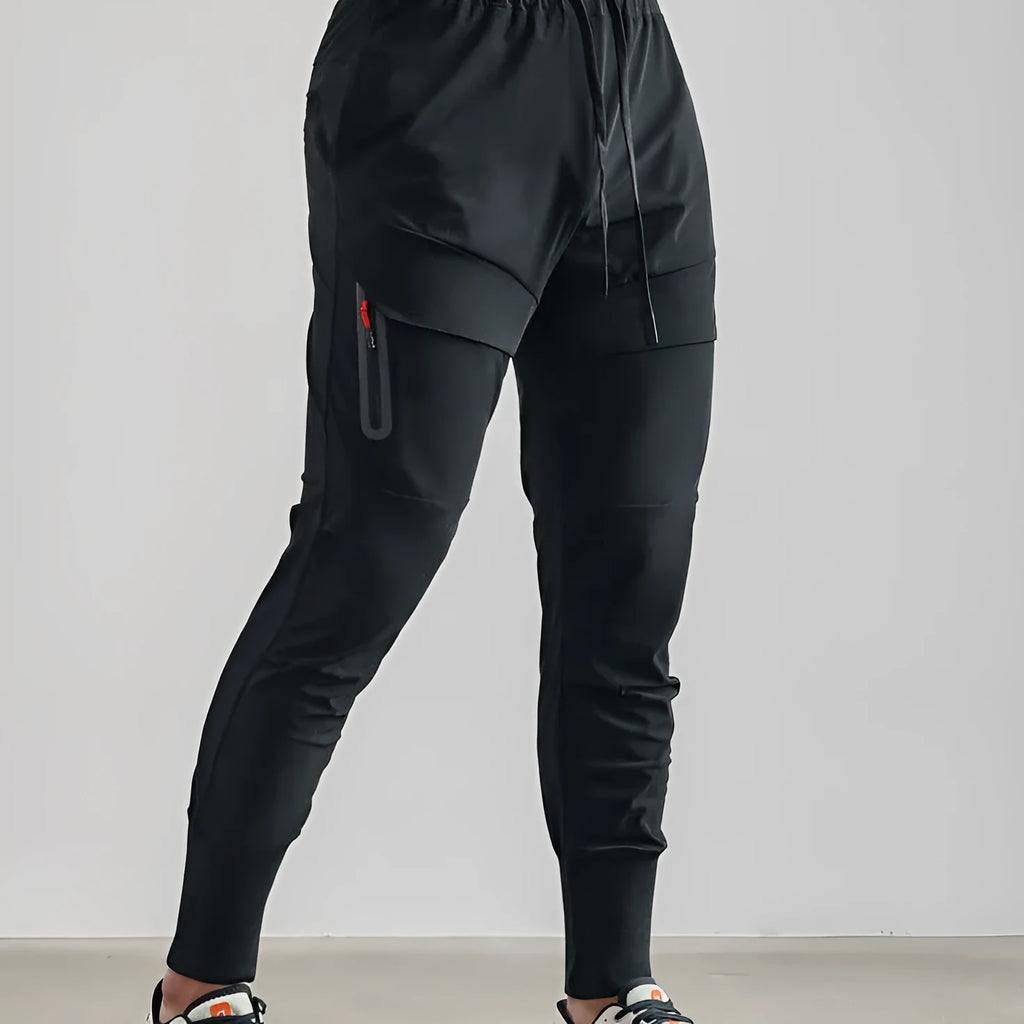 Men's solid colour polyester jogger pants in black, mid-waist micro-elasticity sports trousers for autumn leisure.