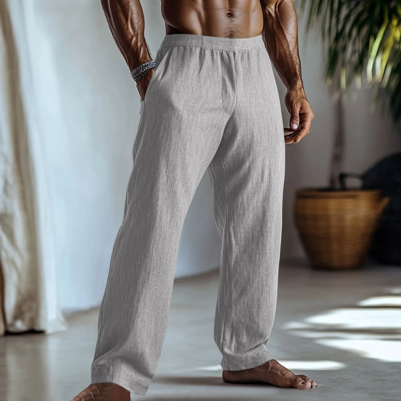 Straight-leg cotton linen trousers in light green on a hanger