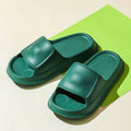 Pair of thick-soled EVA flip-flop slippers in a chosen colour on a plain background.