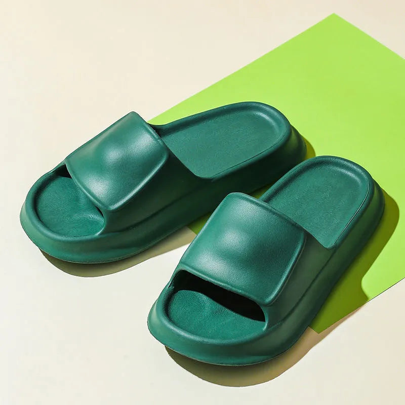 Pair of thick-soled EVA flip-flop slippers in a chosen colour on a plain background.