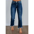 Women's solid colour denim jeans in dark blue showing hand-worn texture and casual fit.