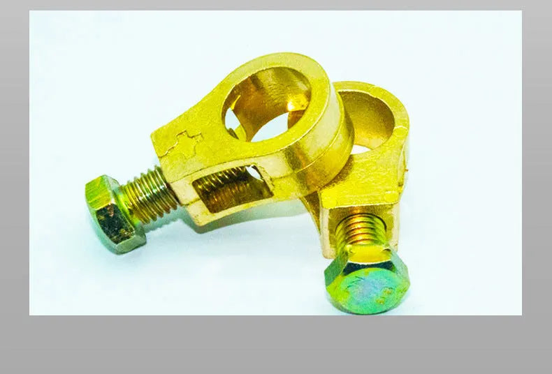 Pure copper car battery terminal clamp or connector on a white background.