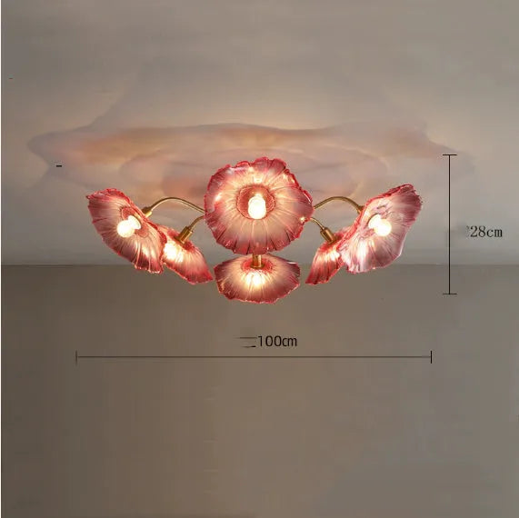 Modern ceiling lamp with cluster of artificial white flowers and warm glowing light.
