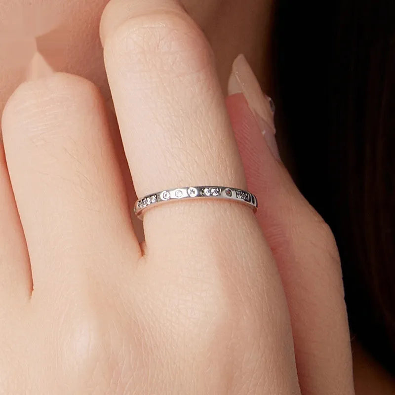 Silver I Love You Moss password ring with oxidized black finish showing engraved code