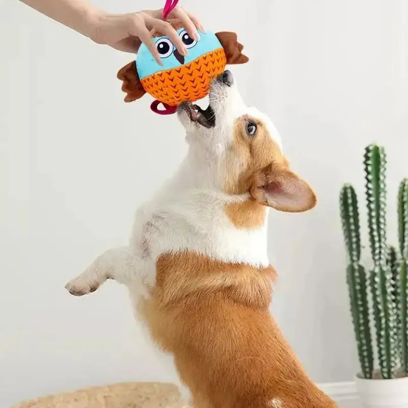 Orange Owl Ball interactive dog toy with velvet surface and rubber core on white background